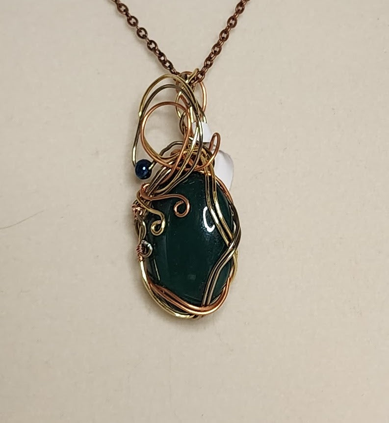 Elegant Tri-Metal and Dark Emerald Green Pendant